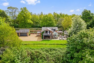 A Stunning Lakeside Home on Holmes Chapel Road, Lower Withington